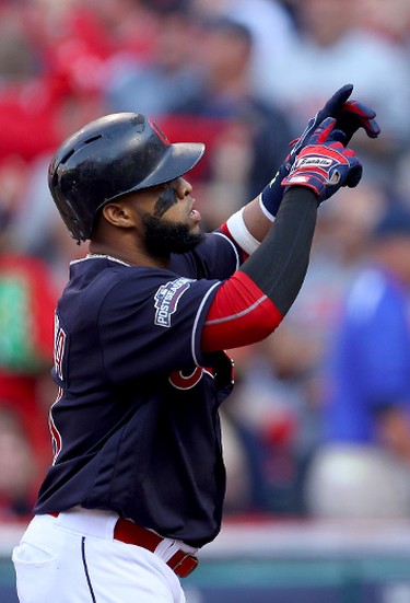 Carlos Santana of the Cleveland Indians celebrates after hitting a home run in the second inning against J.A. Happ of the Toronto Blue Jays during Game 2 of the American League Championship Series at Progressive Field on Oct. 15, 2016 in Cleveland, Ohio. (Maddie Meyer/Getty Images)