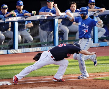 Cleveland Indians first baseman Mike Napoli forces out Toronto Blue Jays' Jose Bautista at first during the second inning in Game 2 of the American League Championship Series in Cleveland on Oct. 15, 2016. (AP Photo/Charlie Riedel)