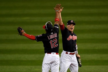 Francisco Lindor and Brandon Guyer of the Cleveland Indians celebrate after defeating the Toronto Blue Jays in Game 2 of the American League Championship Series at Progressive Field on Oct. 15, 2016 in Cleveland. (Jason Miller/Getty Images)