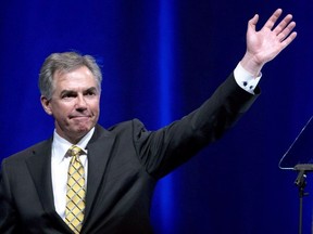 Outgoing Premier Jim Prentice waves after his speech at the Alberta PC Dinner in Calgary, Alberta on Thursday May 14, 2015. According to media reports former Alberta premier Prentice died Thursday in a plane crash outside of Kelowna, British Columbia. THE CANADIAN PRESS/Larry MacDouga