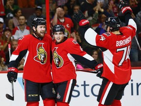 Senators forward Zack Smith (left) is congratulated by teammates Chris Wideman (centre) and Mark Borowiecki after scoring on Oct. 15 against the Montreal Canadiens. (Errol McGihon, Ottawa Sun)