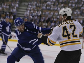 Leafs centre Nazem Kadri (left) and Boston Bruins right winger David Backes fight during the Leafs home opener at the Air Canada Centre on Saturday. (Veronica Henri/Toronto Sun)