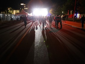 ReUnion Street Festival attendees dance to a DJ at approximately 1 a.m. on Sunday morning. Elliot Ferguson, Kingston Whig-Standard, Postmedia Network.