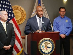 FBI Special Agent in Charge Eric Jackson talks about the FBI's roll in stopping a bomb plot. Acting U.S. Attorney Tom Beall (left) announced Friday a major federal investigation stopped a domestic terrorism plot by a militia group to detonate a bomb at a Garden City apartment complex where a number of Somalis live. (Bo Rader/The Wichita Eagle via AP)