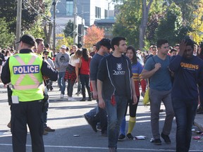 Kingston Police officers during Queen's University Homecoming 2016 in Kingston, Ont. on Saturday, Oct. 15, 2016. Steph Crosier/Kingston Whig-Standard/Postmedia Network