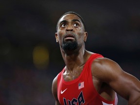 Tyson Gay looks at his time from a men's 100-meter semifinal at the World Athletics Championships at the Bird's Nest stadium in Beijing. (AP Photo/David J. Phillip, File)