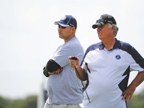 While head coach Scott Milanovich (left) is stuck for answers to the Argos losing nine of their past 10 and falling out of the playoff race, GM Jim Barker has made things worse with his costly trade for Drew Willy and not surrounding himself with a more experienced support staff. (Brian Blanco, photo)
