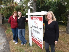 Homeowner Lisa Blankenhorn and Paul Long are pictured with their agent, Ora Ross. (MICHAEL PEAKE, Toronto Sun)