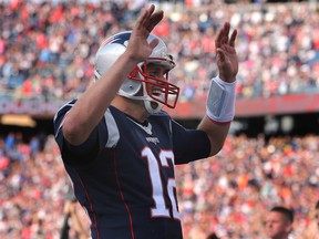 New England's Tom Brady became the fourth NFL quarterback in history to complete 5,000 passes. (AP)