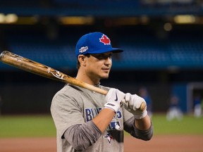 Blue Jays infielder Darwin Barney takes part in a team practice in Toronto ahead of Game 3 of the ALCS against the Indians on Sunday, Oct.16, 2016. (Christopher Katsarov/The Canadian Press)