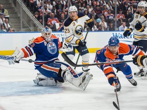 Oilers goalie Cam Talbot watches the puck fly by during the first period of Sunday's game at Rogers Place. (Shaughn Butts)