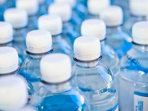 Water bottles are pictured on a conveyor belt at a bottling plant in this file photo. (P_Wei/Getty Images)