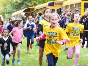 Competitors in the 8-and-under girls division, including Ava Harmer (center) and Jessie Horan (right), of Upper Thames Elementary School, race to the finish at the Avon Maitland District School Board elementary schools district cross-country championships at Wildwood Conservation Area last Thursday, Oct. 13. SCOTT WISHART POSTMEDIA NETWORK
