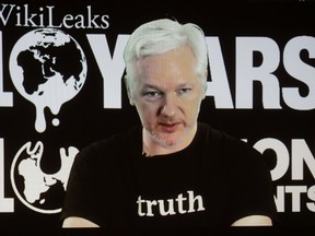 In this Oct. 4, 2016 file photo, WikiLeaks founder Julian Assange participates via video link at a news conference marking the 10th anniversary of the secrecy-spilling group in Berlin. WikiLeaks said on Monday, Oct. 17, 2016, that Assange's internet access has been cut by an unidentified state actor. (AP Photo/Markus Schreiber, File)