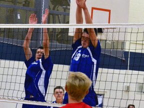 During a Huron-Perth regular season game against St. Marys last Tuesday, Oct. 11, Mitchell District High School's Alec Murray (left) and Darren Dixon leap up for the block, narrowly missing their target. The hometown Blue Devils lost two of the three games in the match, 14-25, 25-17 and 29-31, and remain 0-4 overall on the young season but continue to show improvement. GALEN SIMMONS MITCHELL ADVOCATE