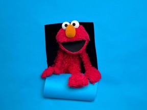 In this Jan. 24, 2011, file photo, Elmo of the film "Being Elmo" poses for a portrait in the Fender Music Lodge during the 2011 Sundance Film Festival in Park City, Utah. (AP Photo/Victoria Will, File)