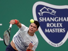 Milos Raonic of Canada serves against Pablo Lorenzi of Italy during the men's singles match of the Shanghai Masters tennis tournament at Qizhong Forest Sports City Tennis Center in Shanghai, China, Wednesday, Oct. 12, 2016. (AP Photo/Andy Wong)