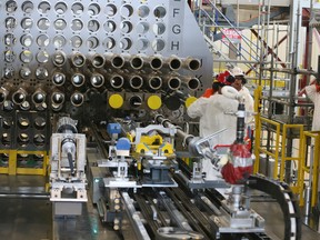 Workers by a a full-scale reactor mock-up,at the Darlington Nuclear Generating Station on Friday October 14, 2016, marking the beginning of a refurbishment project that is expected to be completed by 2026. Veronica Henri/Postmedia Network