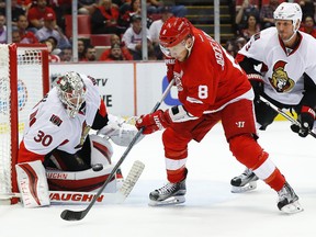 Senators goalie Andrew Hammond stops a shot from Red Wings left wing Justin Abdelkader in the second period of an NHL game at Joe Louis Arena in Detroit on Monday, Oct. 17, 2016. (Paul Sancya/AP Photo)
