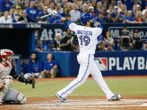 Blue Jays batter Jose Bautista pops out against the Indians during Game 3 of the AL Championship Series in Toronto on Monday, Oct. 17, 2016. (Stan Behal/Toronto Sun)