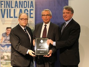 Kevin McCormick, left, president and vice-chancellor of Huntington University, and Gerry Lougheed Jr., right, chair of Finlandia SISU Foundation, make a presentation to Dr. John Maki, Canadian Finnish Institute Fellow. Supplied photo