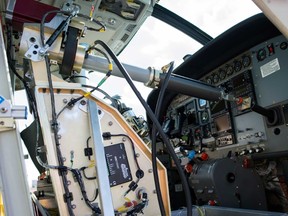 Aurora Flight Sciences' Aircrew Labor In-Cockpit Automantion System (ALIAS), is mounted in the co-pilot seat of a Cessena Caravan aircraft at Manassas Airport in Manassas, Va., Monday, Oct. 17, 2016. (AP Photo/Cliff Owen)