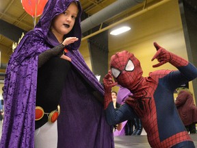 Teen Titan Raven and Spiderman (Kendal and Lucas Stoffyn respectively) act out their characters at the C-K Expo.