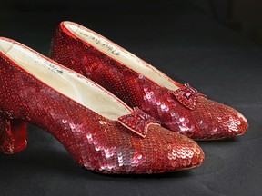 This Nov. 9, 2001, file photo shows the sequin-covered ruby slippers worn by Judy Garland in "The Wizard of Oz" at the offices of Profiles in History in Calabasas, Calif. Smithsonian Museum officials started a Kickstarter fundraising drive Monday, Oct. 17, 2016, to repair the iconic slippers from 1939’s “The Wizard of Oz” and create a new state-of-the-art display case for them at the National Museum of American History. (AP Photo/Reed Saxon, File)