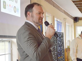 Stg. Brian Knowler and Const. Jay Denorer, with the OPP, give a presentation about Shop with a Cop at the Rotary Club of Chatham Oct. 12. The program, now it its third year, seeks to mend relationships between police officers and children who may have had negative experiences with police.