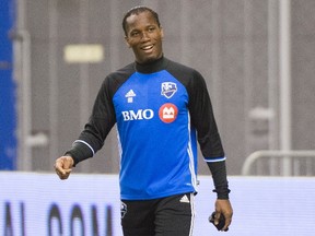 Montreal Impact's Didier Drogba smiles as he arrives for a training session in Montreal on March 1, 2016, ahead of the Impact's season opener against the Vancouver Whitecaps. (THE CANADIAN PRESS/Graham Hughes)