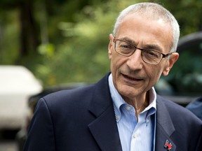 In this Oct. 5, 2016, photo, Hillary Clinton campaign chairman John Podesta speaks to members of the media outside Clinton’s home in Washington. (AP Photo/Andrew Harnik)