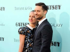 In this May 1, 2013, file photo, actor Tobey Maguire, right, and wife Jennifer Meyer attend "The Great Gatsby" world premiere in New York.  (Photo by Evan Agostini/Invision/AP, File)
