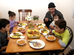 Syrian refugee family members, including Ouday, 9, Rouba, 4, father Marwan with Masey, 18 months, and Kousay, 8, at their Kingston home. (Ian MacAlpine/The Whig-Standard)