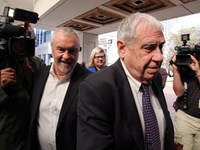 Bruce Carson, a former Stephen Harper adviser, makes his way to the Ottawa court house to face an influence-peddling charge handed down in 2012 and linked to the proposed sale of water-filtration systems to native reserves, in Ottawa, Monday September 14, 2015. (THE CANADIAN PRESS/Fred Chartrand)