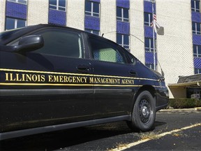 In this Friday, Oct. 14, 2016 photo, an Illinois Department of Emergency Management vehicle is parked at the entrance to their office in Springfield, Ill. (AP Photo/Seth Perlman)