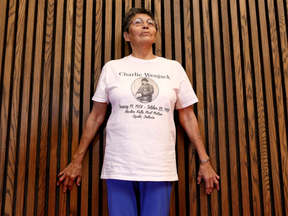 Pearl Achneepineskum, sister of Chanie Wenjeck, talks to the media at the NAC in Ottawa Ontario Tuesday Oct. 18, 2016