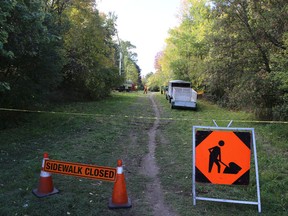 Workers remove trees along the Rideau Trail to clear space for relocated electrical poles in Kingston. (Elliot Ferguson/The Whig-Standard)