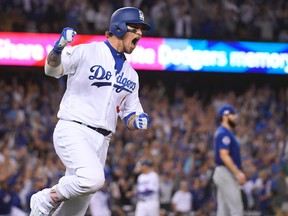 Dodgers' Yasmani Grandal hits a two-run home run during the fourth inning of Game 3 of the NL Championship Series against the Cubs in Los Angeles on Tuesday, Oct. 18, 2016. (Mark J. Terrill/AP Photo)