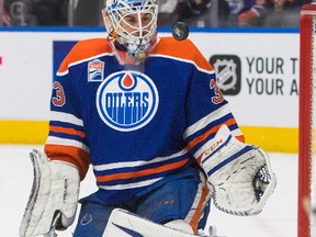 Edmonton Oilers' goalie Cam Talbot (33) makes a save against the Carolina Hurricanes during first period NHL hockey action in Edmonton, Alta., on Tuesday October 18, 2016. THE CANADIAN PRESS/Amber Bracken