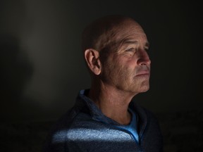Terry Patterson, 52, sits in his home in Waterloo, Ont. on Friday, Oct. 14, 2016. Patterson was 49 when he was diagnosed with a tumour on his tonsil caused by HPV. He is advocating for young people to get vaccinated against the virus. (THE CANADIAN PRESS/Hannah Yoon)
