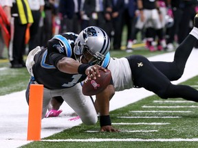 Cam Newton of the Carolina Panthers scores a touchdown against Cameron Jordan of the New Orleans Saints during the fourth quarter at the Mercedes-Benz Superdome on Oct. 16, 2016 in New Orleans, Louisiana. (Sean Gardner/Getty Images)