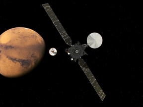 In this artist impression provided by the European Space Agency, ESA, the ExoMars Trace Gas Orbiter, TGO, right, and its entry, descent and landing demonstrator module, Schiaparelli, center, approaching Mars. The separation was scheduled to occur on Sunday Oct. 16, about seven months after launch. Schiaparelli is set to enter the martian atmosphere on Wednesday, Oct. 19, 2016 while TGO will enter orbit around Mars. The probe will take images of Mars and conduct scientific measurements on the surface, but its main purpose is to test technology for a future European Mars rover. Schiaparelli's mother ship will remain in orbit to analyze gases in the Martian atmosphere to help answer whether there is or was life on Mars. (ESA ATG/medialab via AP)