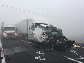 Vehicles remain at the scene of a traffic accident along Interstate 40 on Wednesday, Oct. 19, 2016, in northern Arizona near Parks, Ariz. (Arizona Department of Public Safety via AP)