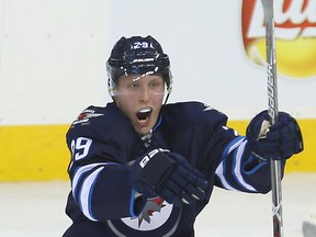 Jets right winger Patrik Laine celebrates his second goal against the Maple Leafs in the third period during NHL action in Winnipeg on Wednesday, Oct. 19, 2016. (Brian Donogh/Postmedia Network)