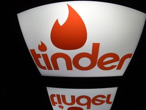 A picture shows the logo of dating app Tinder on a tablet in Paris on March 15, 2016. (LIONEL BONAVENTURE/AFP/Getty Images)
