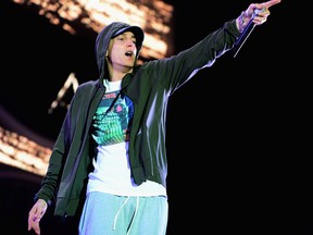 Eminem performs at Samsung Galaxy stage during 2014 Lollapalooza Day One at Grant Park on August 1, 2014 in Chicago, Illinois. (Photo by Theo Wargo/Getty Images)