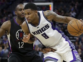 Sacramento Kings forward Rudy Gay, right, drives against Los Angeles Clippers forward Luc Richard Mbah a Moute. (AP Photo/Rich Pedroncelli)