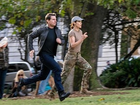 In this image released by Paramount Pictures, Tom Cruise, left, and Cobie Smulders appear in a scene from "Jack Reacher: Never Go Back." (David James/Paramount Pictures and Skydance Productions)