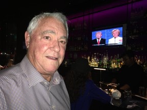 Ron Jones watches the third presidential debate at the Trump Hotel in Toronto (Joe Warmington/Toronto Sun/Postmedia Network)