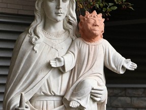 A statue is shown outside Ste. Anne des Pins parish in Sudbury, Ont., on Thursday Oct. 20, 2016. A statue of baby Jesus got a facelift after it was vandalized in northern Ontario - and the result is turning heads. THE CANADIAN PRESS/Gino Donato